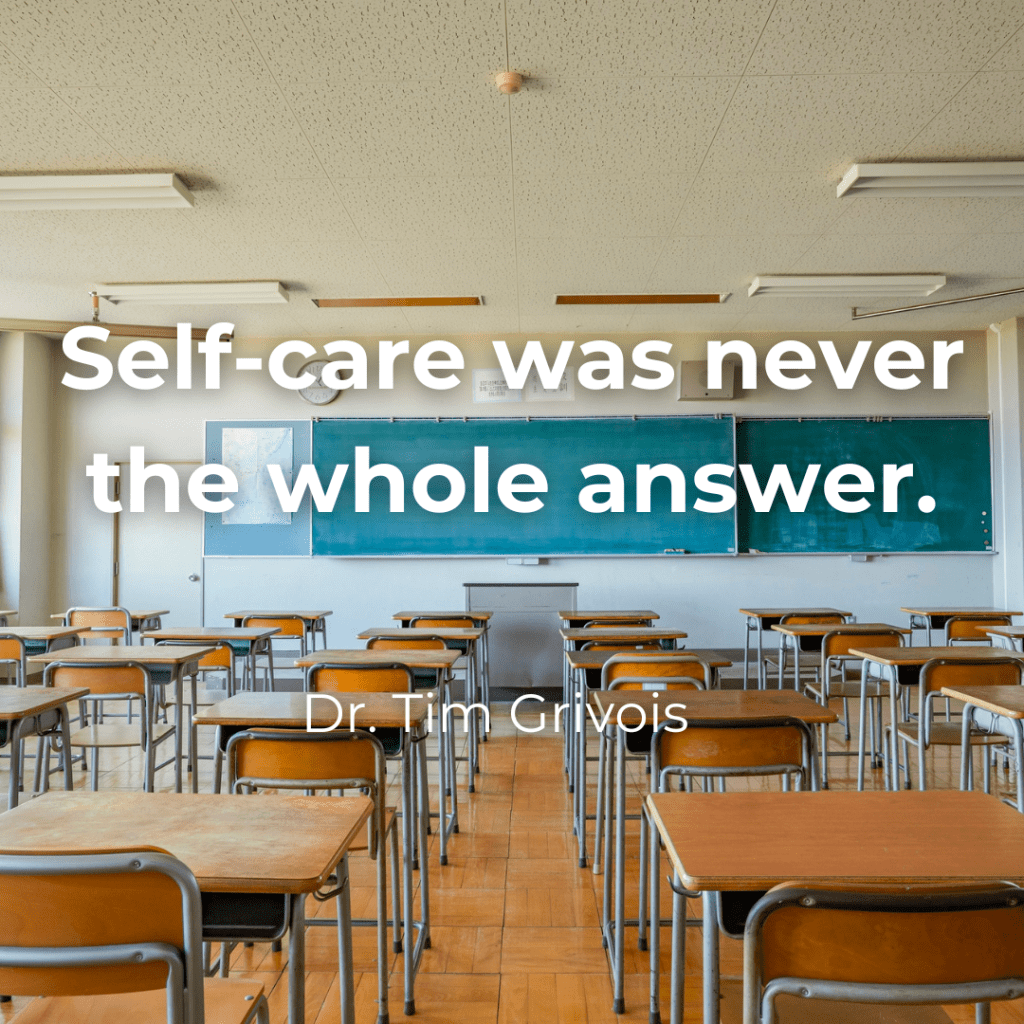 Empty classroom with rows of desks and a chalkboard, overlaid with the text “Self-care was never the whole answer,” illustrating educator wellness as a systems issue rather than an individual responsibility.